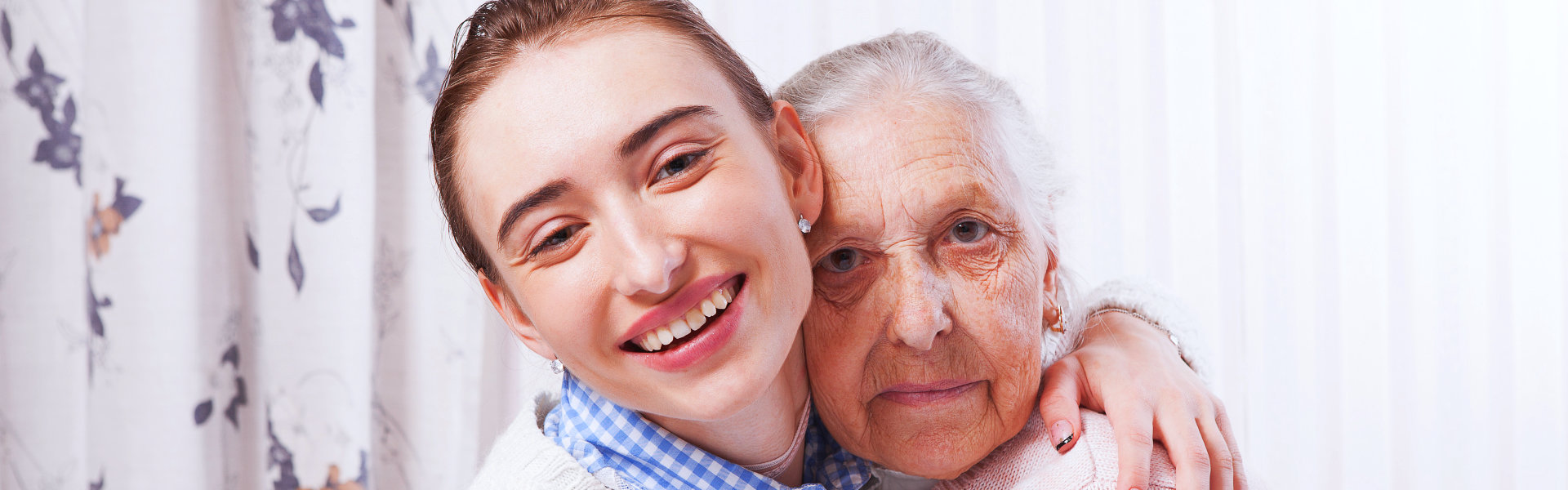 nurse and senior looking at the camera