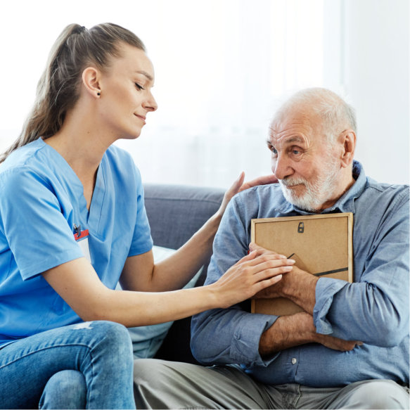 nurse comforting senior