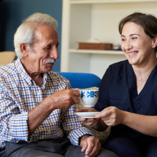 nurse and senior talking